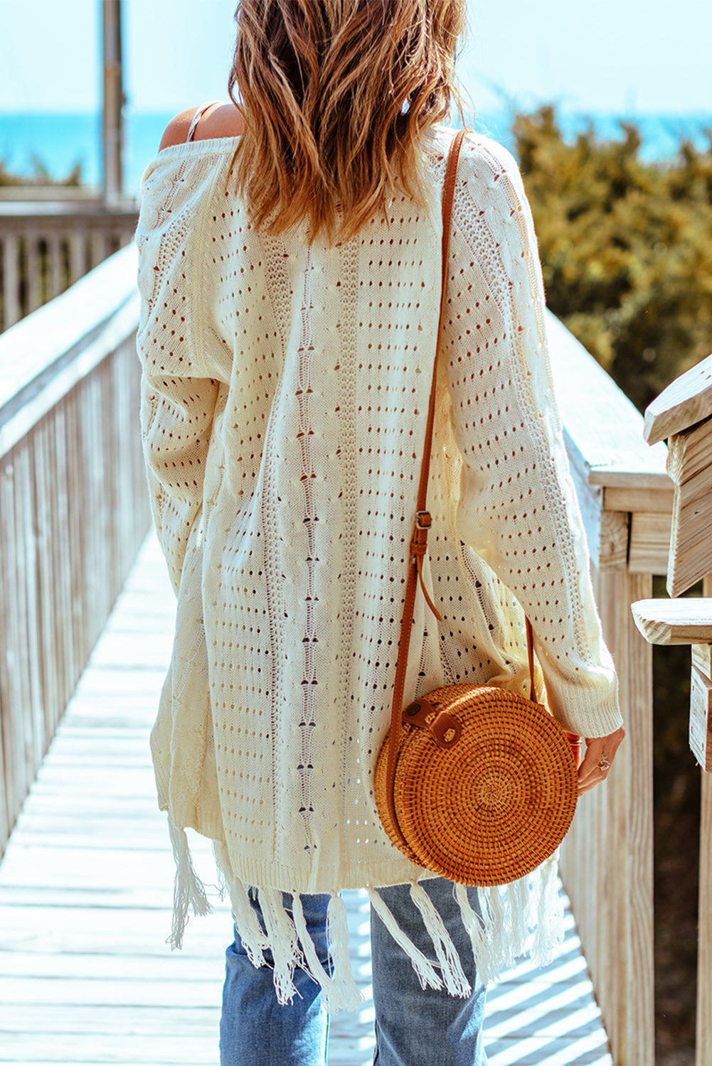 Cardigan en maille torsadée ajourée à glands beige