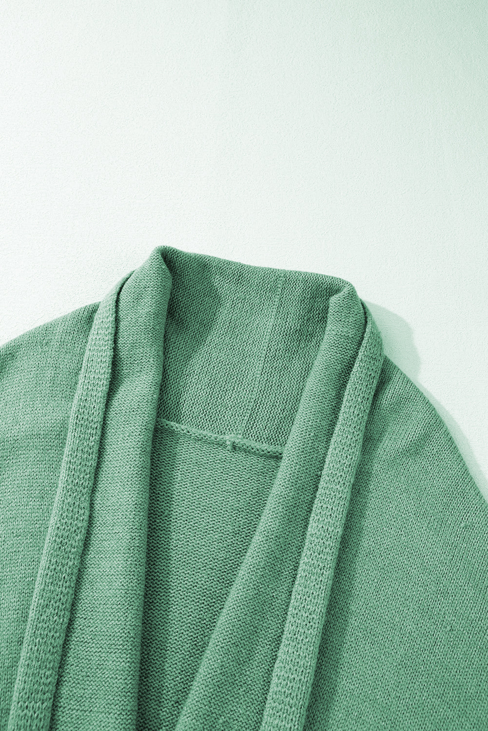 Cardigan épais drapé vert color block ouvert sur le devant