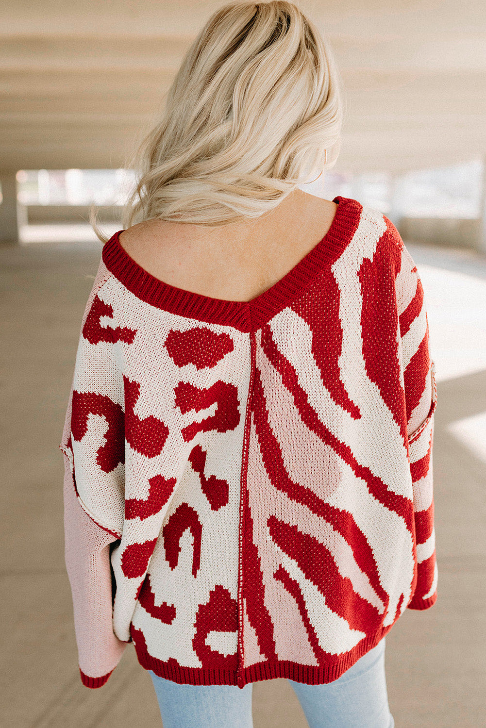 Pull oversize rouge en tricot à motifs mélangés et bordure côtelée