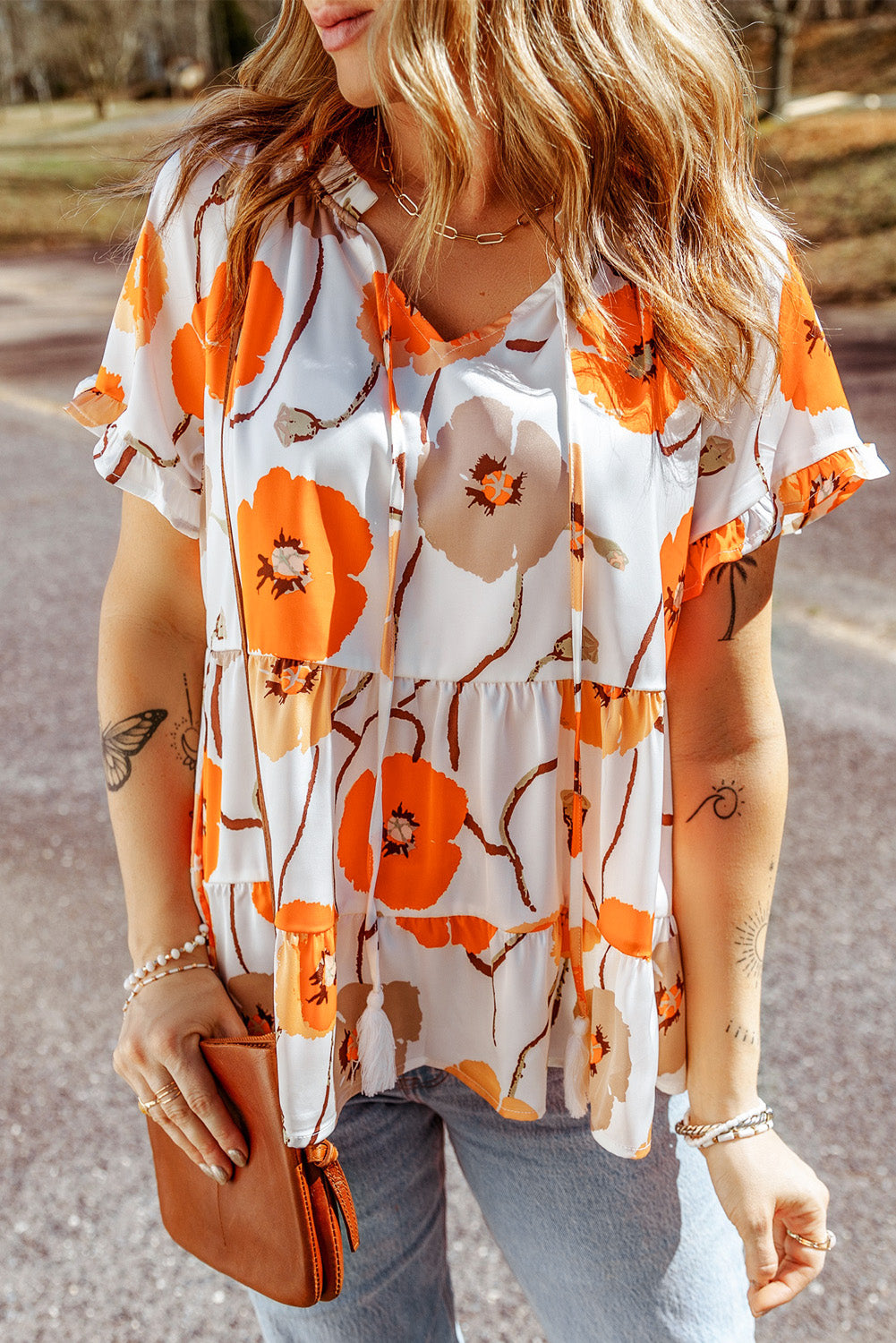 Blouse babydoll orange à imprimé floral et col volanté 