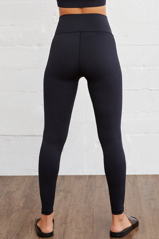 Legging actif sans couture noir à taille arquée 