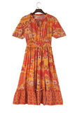 Robe longue orange bohème florale à taille smockée avec fente 