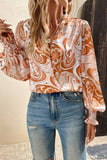 Blouse orange à surplis à manches évêque et imprimé floral tourbillonnant