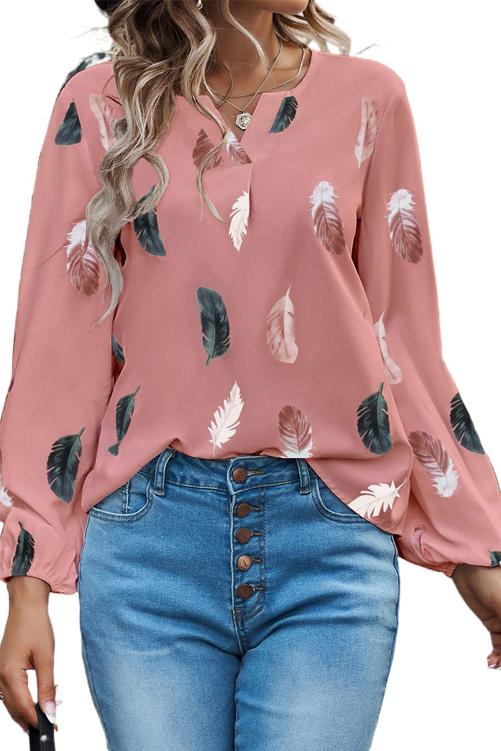 Blouse rose à imprimé plumes et col en V