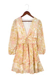 Robe florale jaune à manches longues et col en V