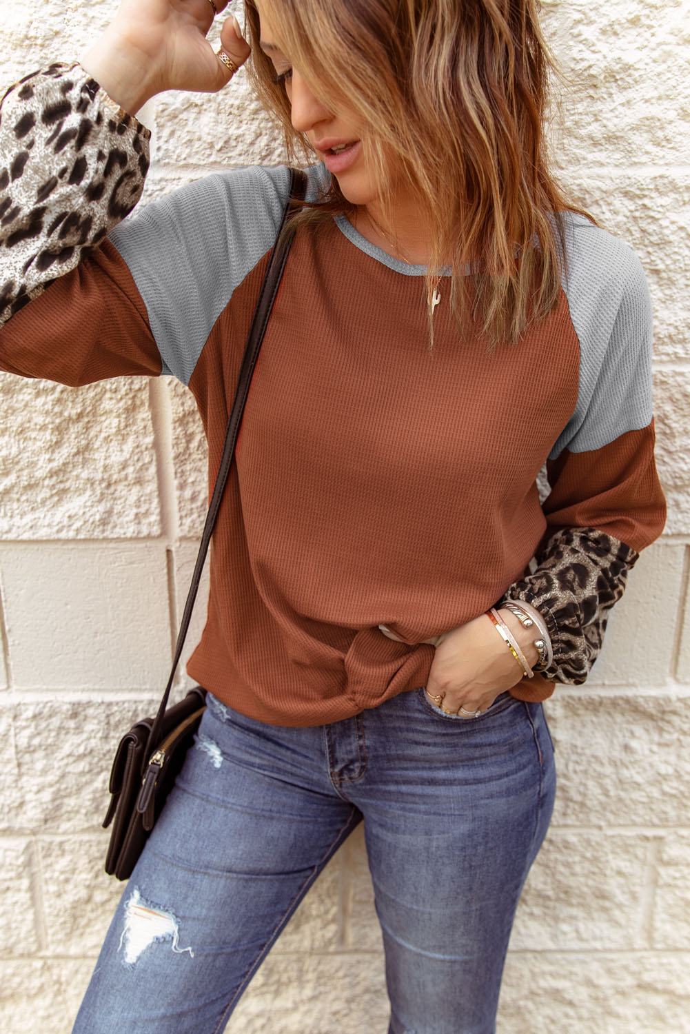 Blouse orange en tricot gaufré à manches longues léopard avec nœud torsadé