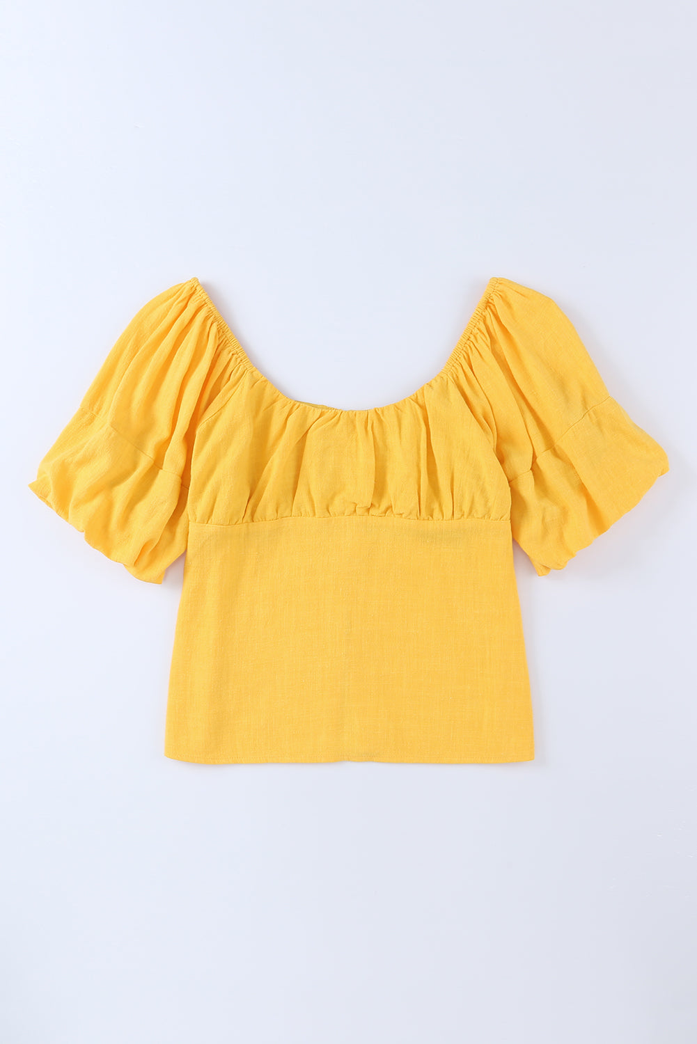 Blouse jaune froncée boutonnée à manches bouffantes