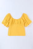 Blouse jaune froncée boutonnée à manches bouffantes