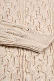 Pull beige en tricot torsadé avec épaules volantées