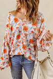 Blouse dolman orange fendue à col en V et imprimé floral 