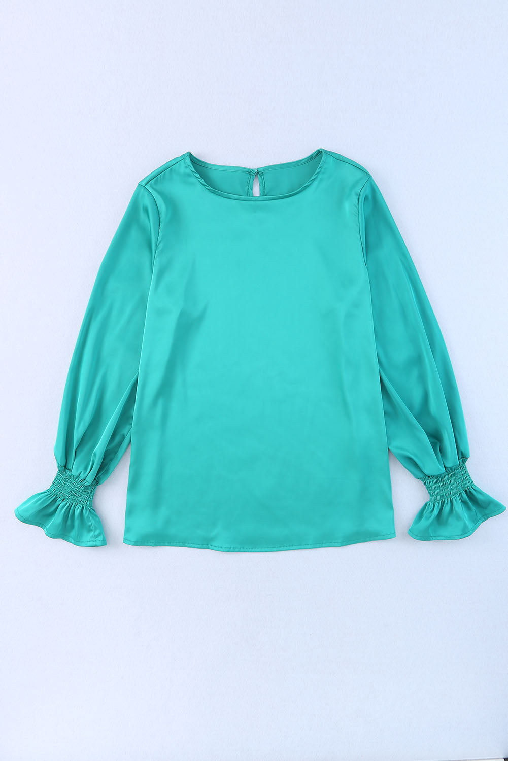 Blouse verte à manches bouffantes en satin