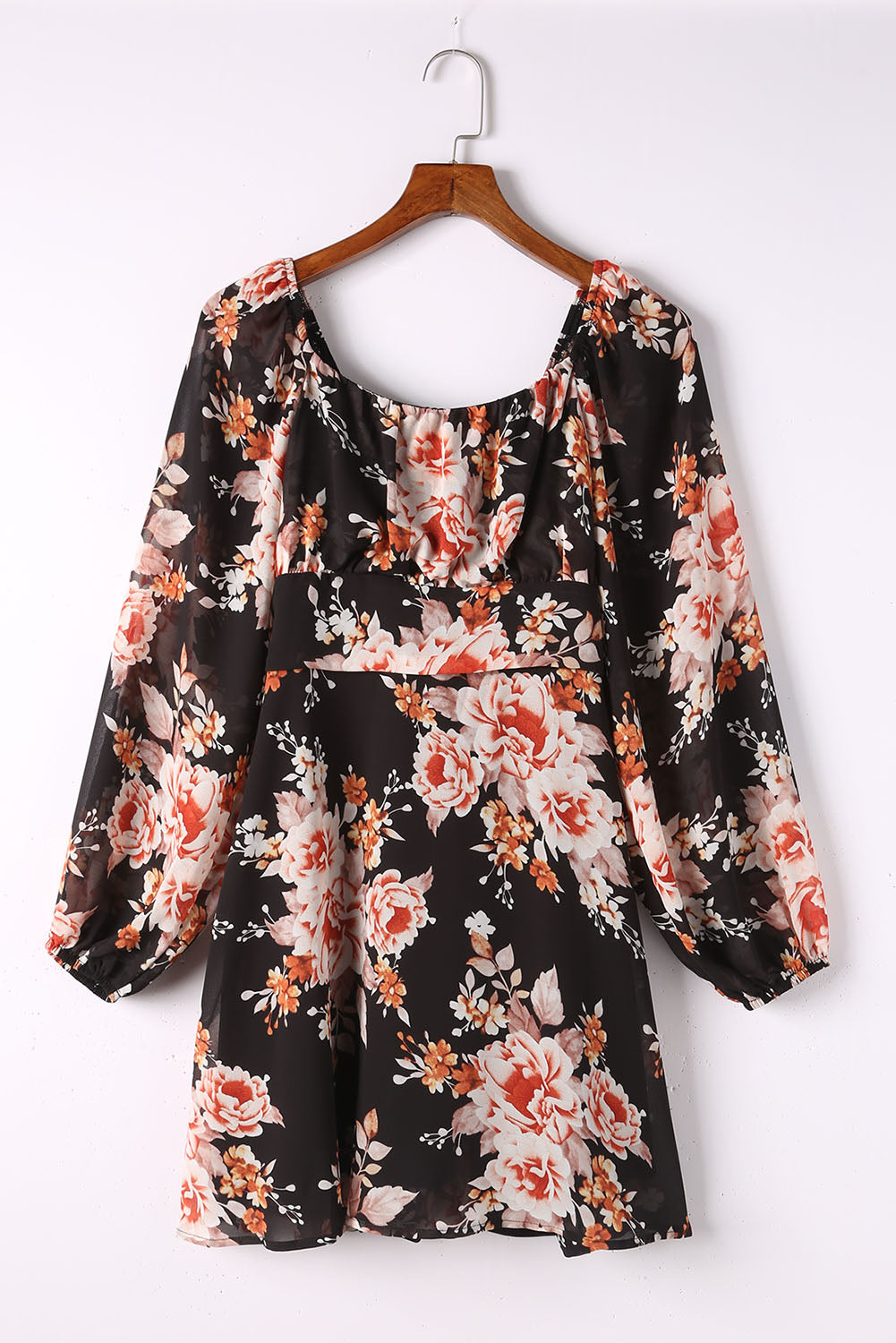 Mini-robe noire à imprimé floral et nouée au dos