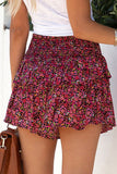 Short rouge à taille smockée à imprimé floral