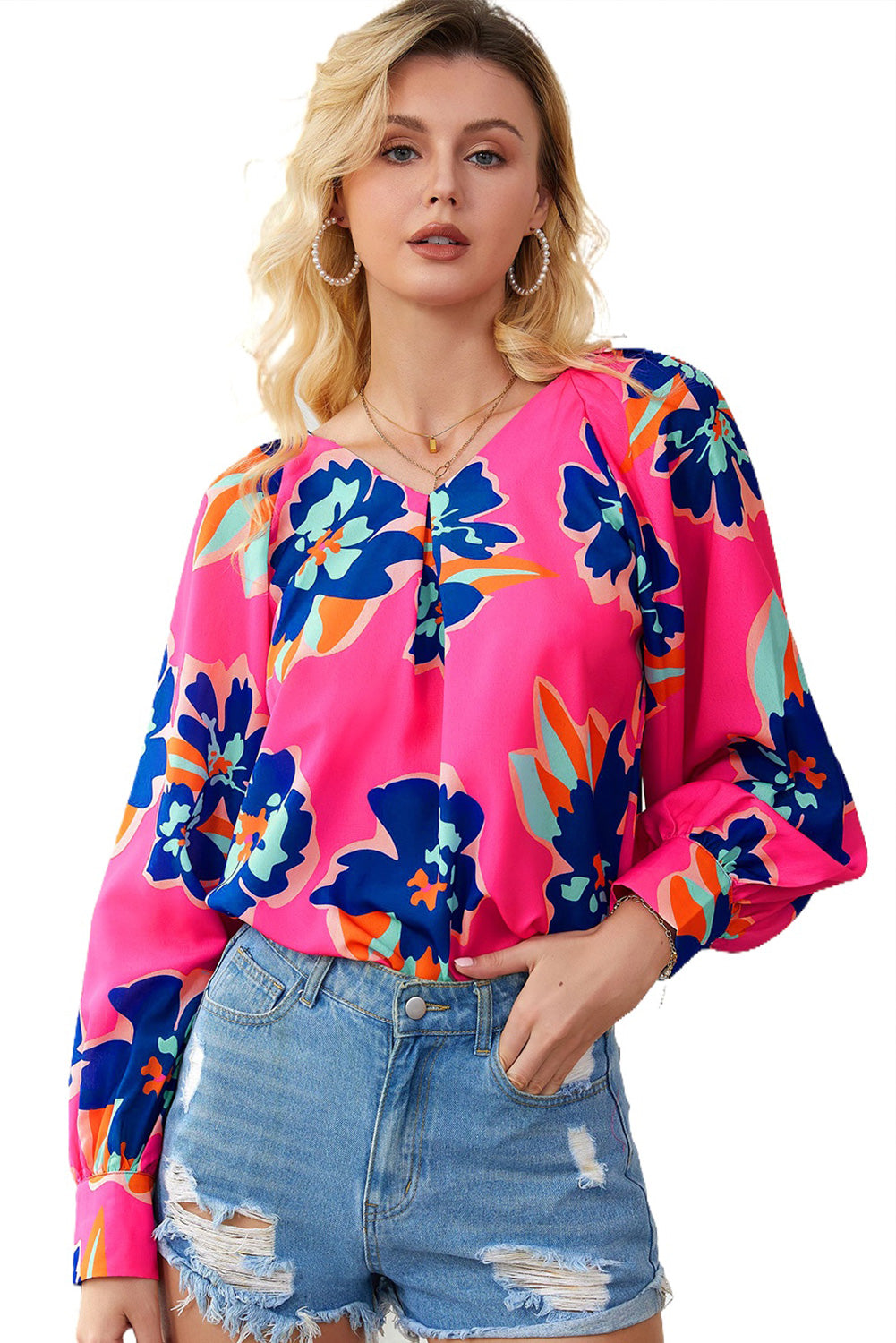 Blouse noire à manches bouffantes et imprimé floral