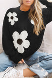 Pull en tricot noir à motif de grandes fleurs