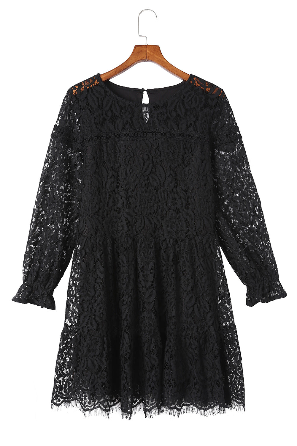 Mini-robe noire à manches longues et épissage en dentelle