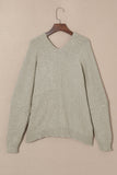 Cardigan pull gris avec poches sur le devant et boutons