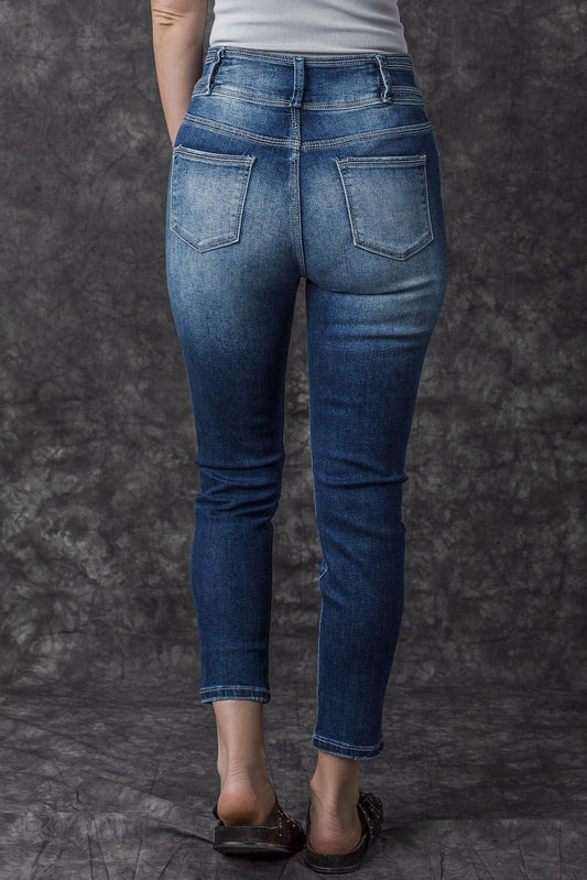 Jean skinny taille haute bleu délavé vintage à deux boutons 