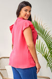 Blouse texturée froissée rose à manches bouffantes et à volants