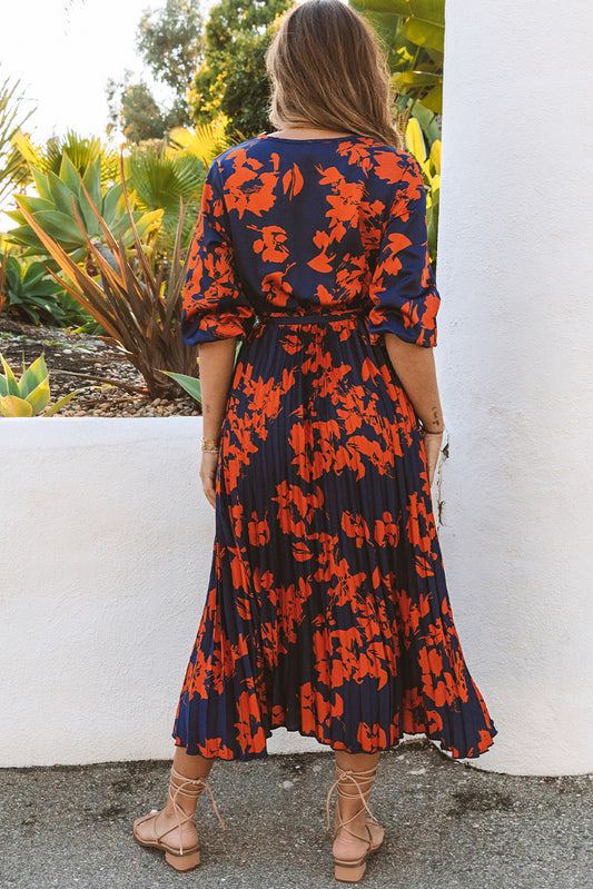 Robe longue plissée à fleurs orange avec col en V et cravate