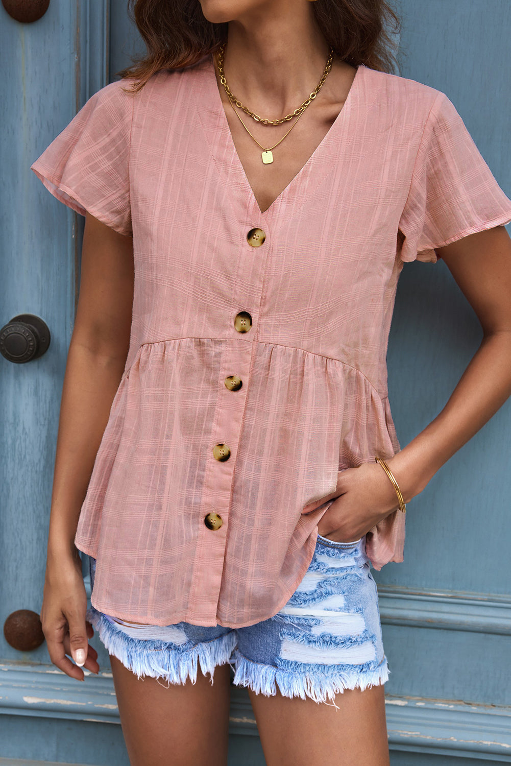 Chemise péplum boutonnée rose à manches courtes