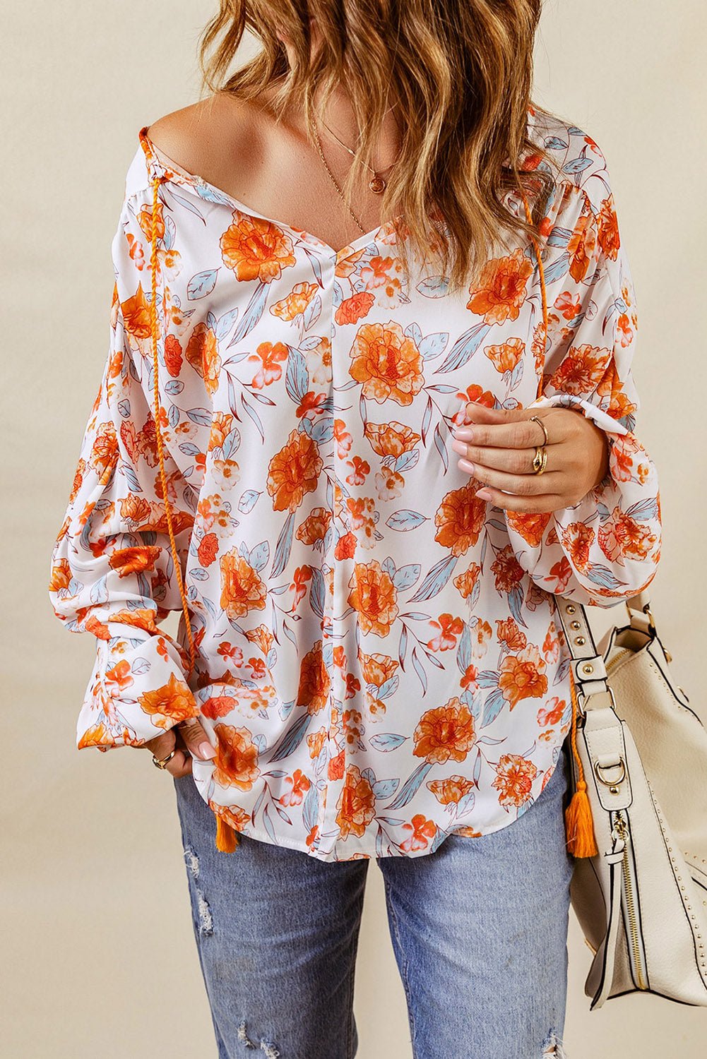 Blouse dolman orange fendue à col en V et imprimé floral 