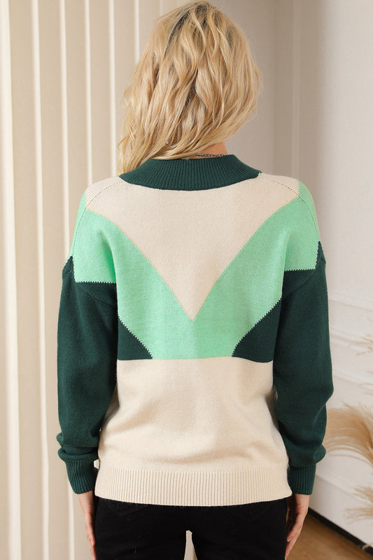 Pull vert à col en V et boutons en tricot à blocs de couleurs géométriques