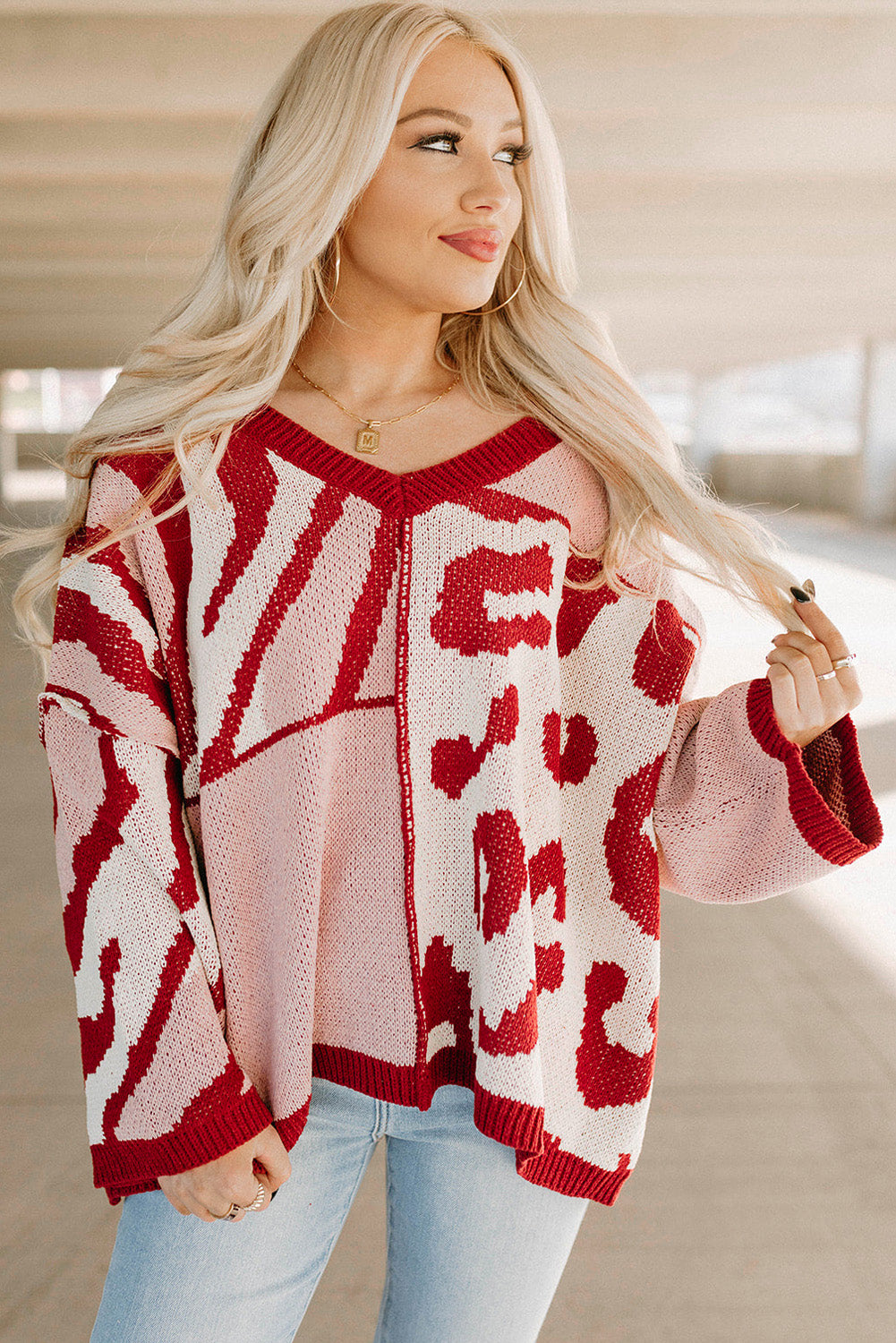 Pull oversize rouge en tricot à motifs mélangés et bordure côtelée