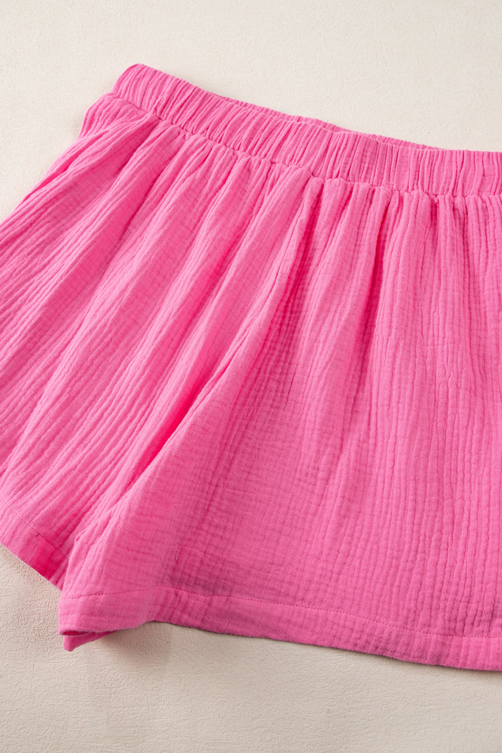 Ensemble polo texturé froissé rose et short taille haute