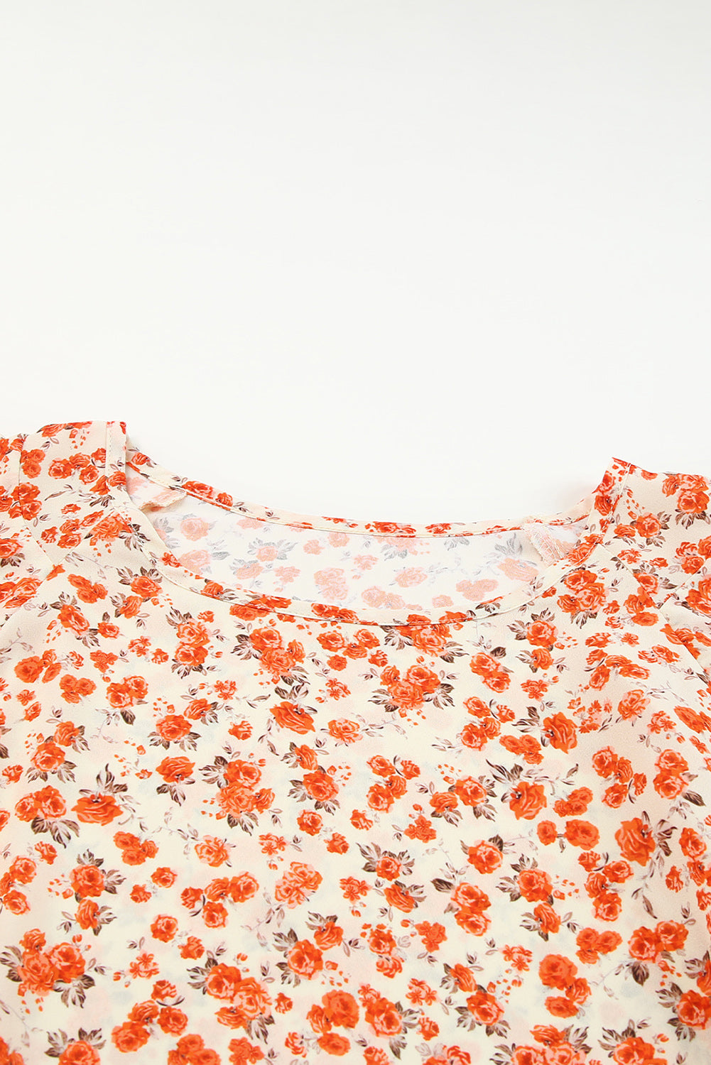 Blouse fleurie orange à manches flottantes et à plusieurs niveaux