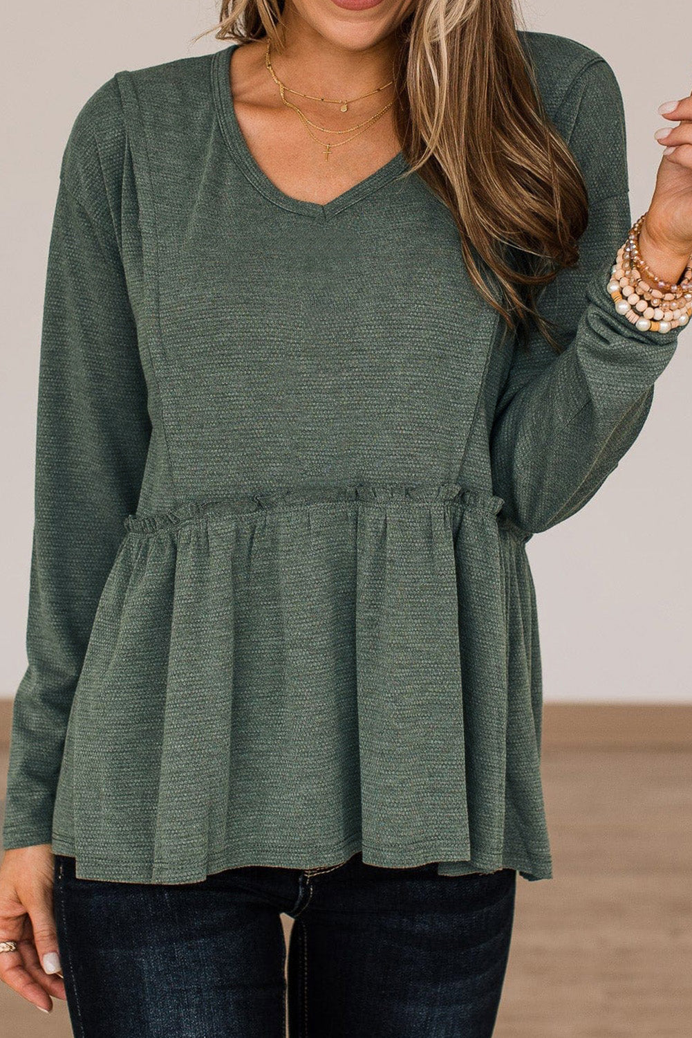 Outseam Detail Long Sleeve Peplum Top