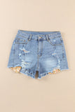 Short en jean bleu ciel à ourlet brut et insert en tricot floral