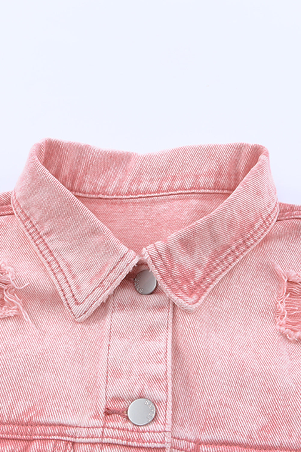 Veste en jean courte rose effet vieilli à franges