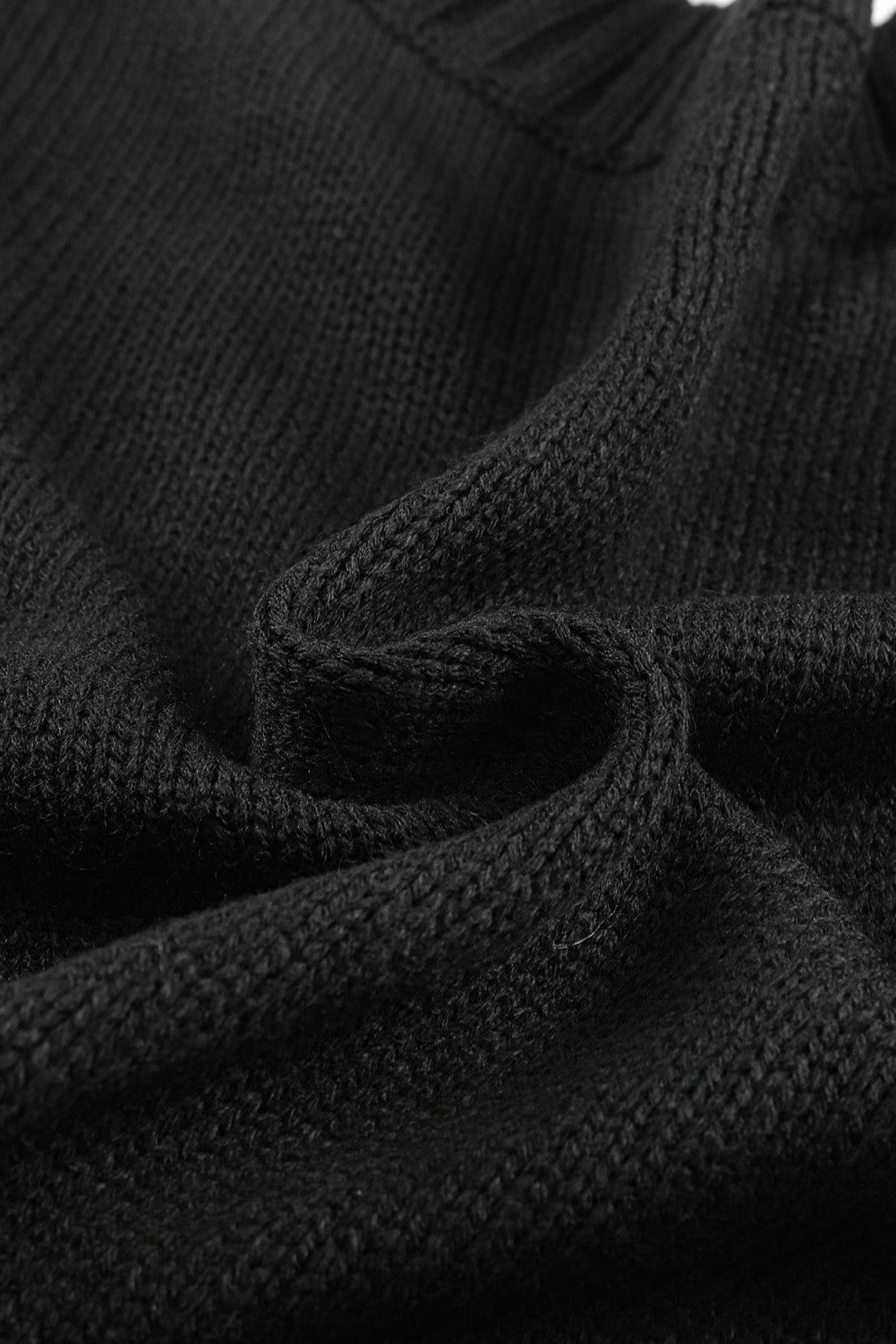 Cardigan texturé noir avec poches avant et boutons