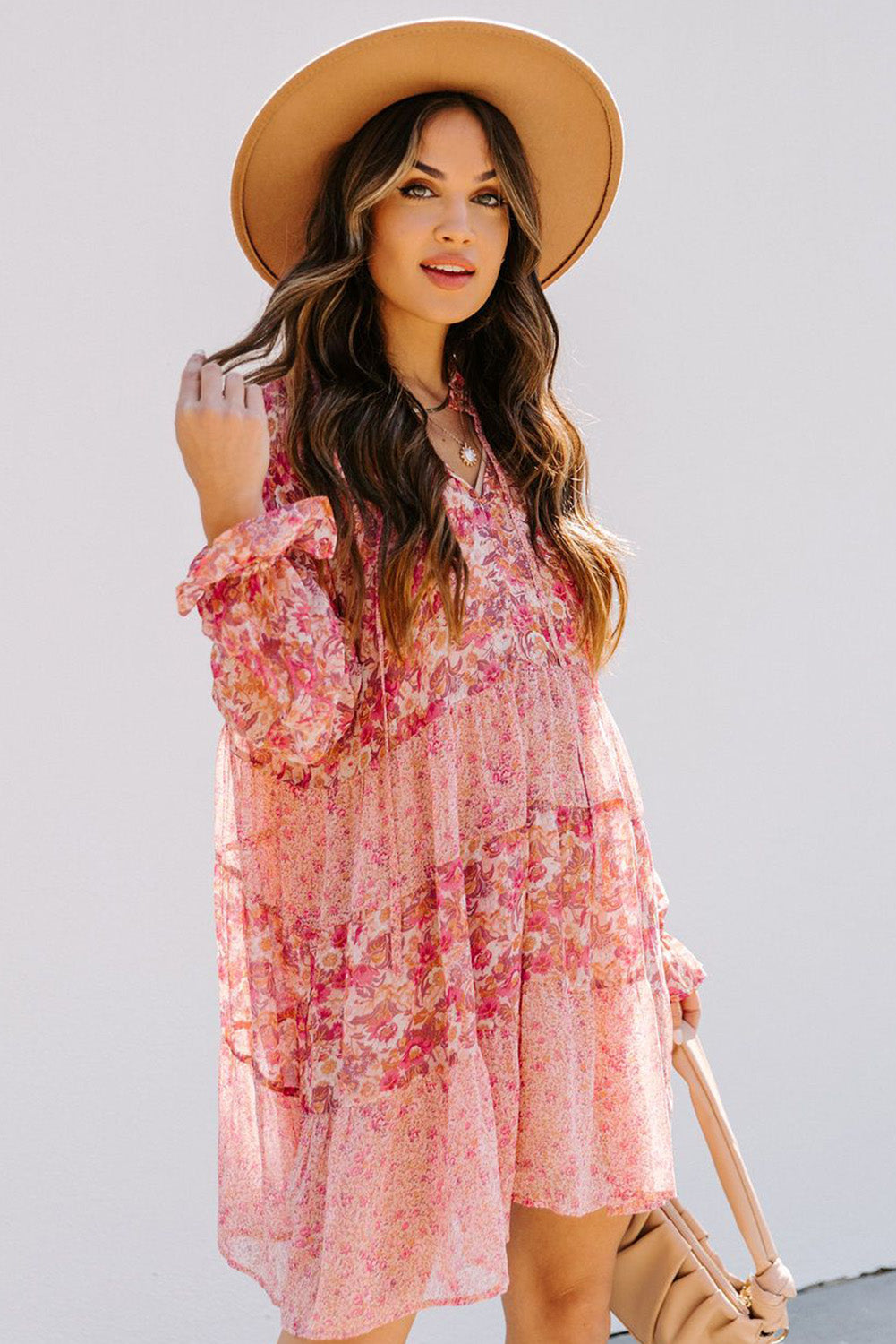 Robe rose à imprimé floral et manches bouffantes