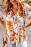 Blouse babydoll orange à imprimé floral et col volanté 