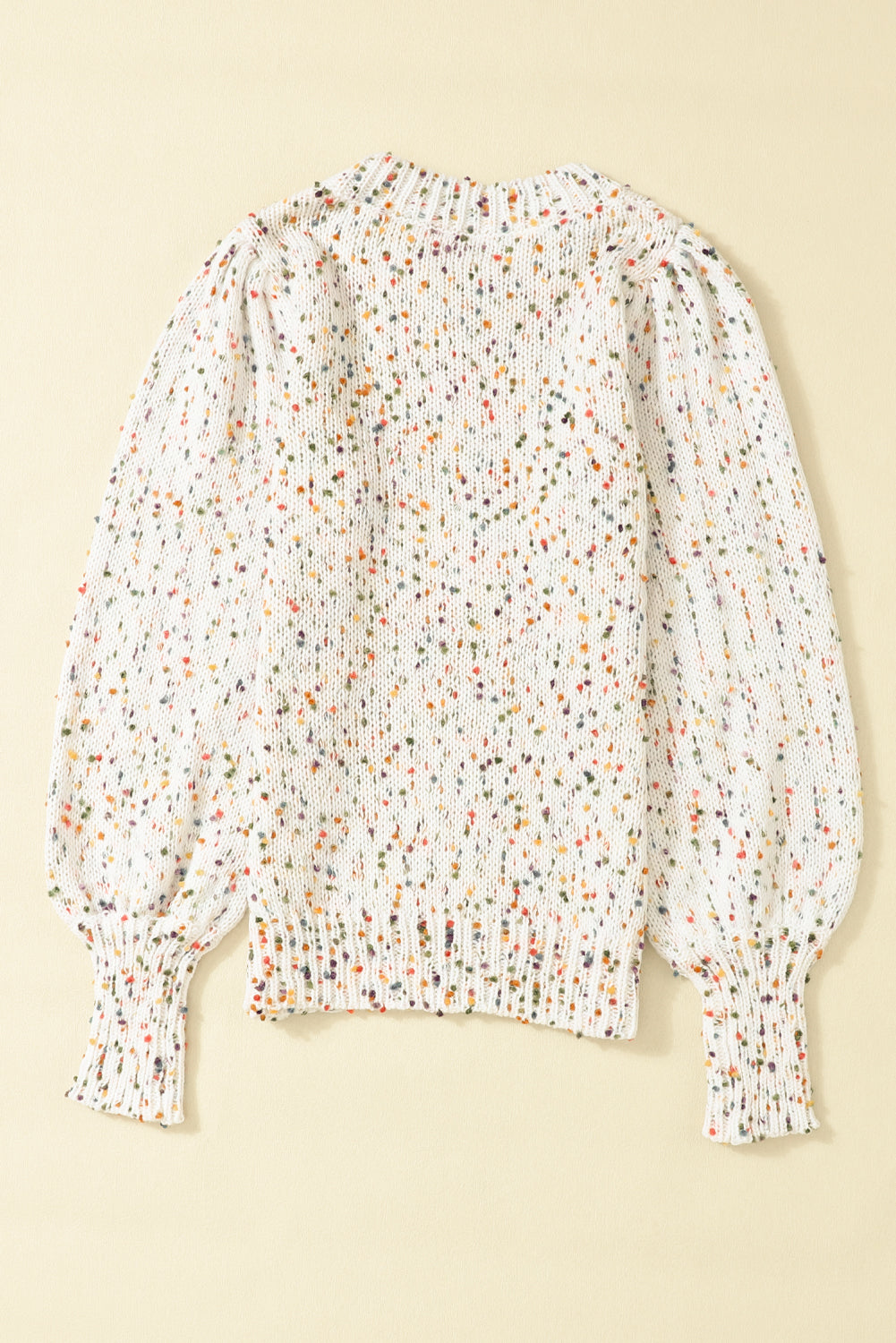 Pull col rond en tricot torsadé beige à pois colorés