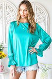 Blouse verte à manches bouffantes en satin