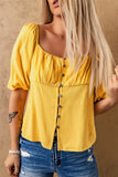 Blouse jaune froncée boutonnée à manches bouffantes