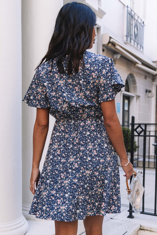 Mini-robe à imprimé floral et nœud papillon à volants et manches courtes bleue