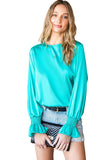 Blouse verte à manches bouffantes en satin