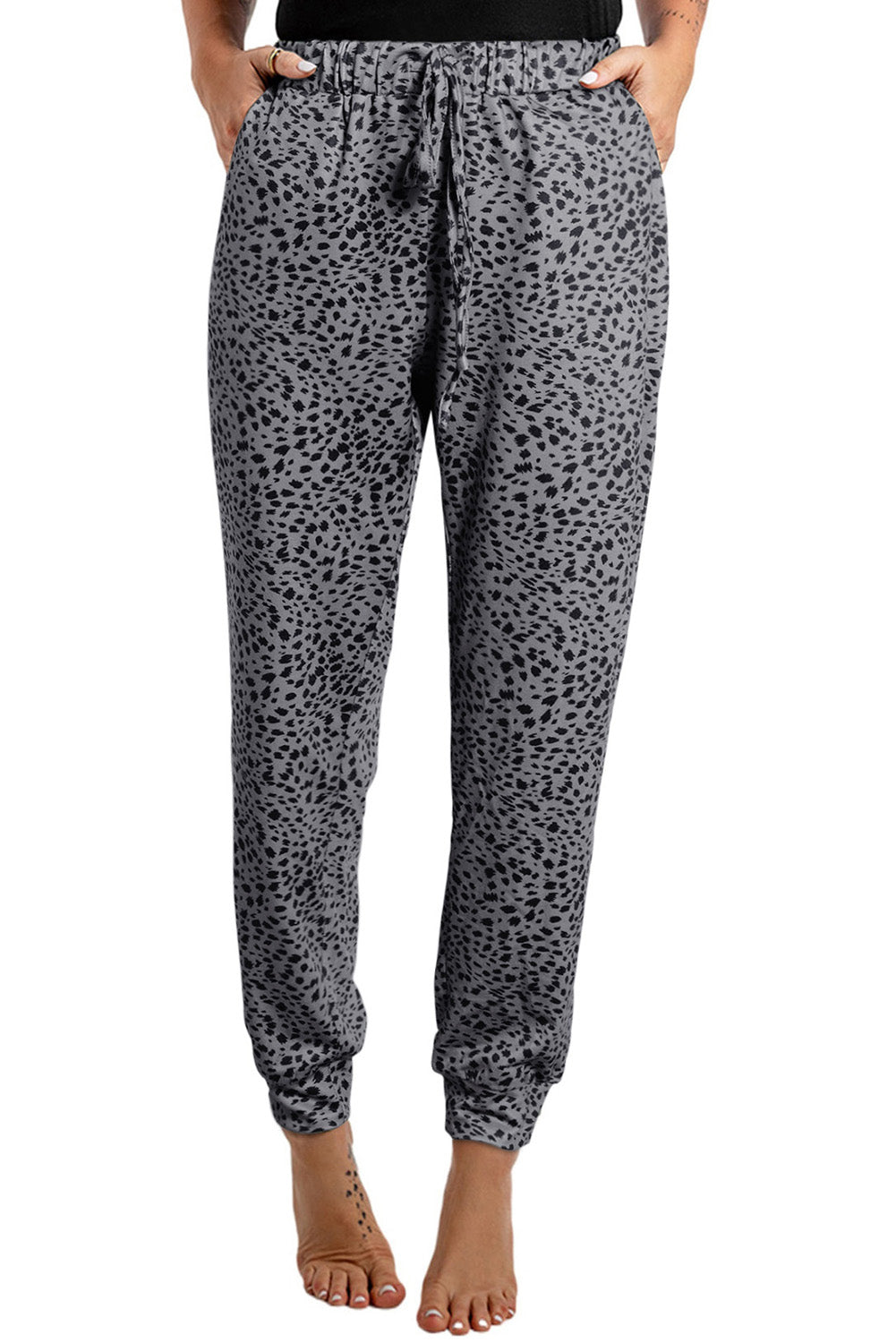 Pantalon de jogging gris à pois et cordon de serrage