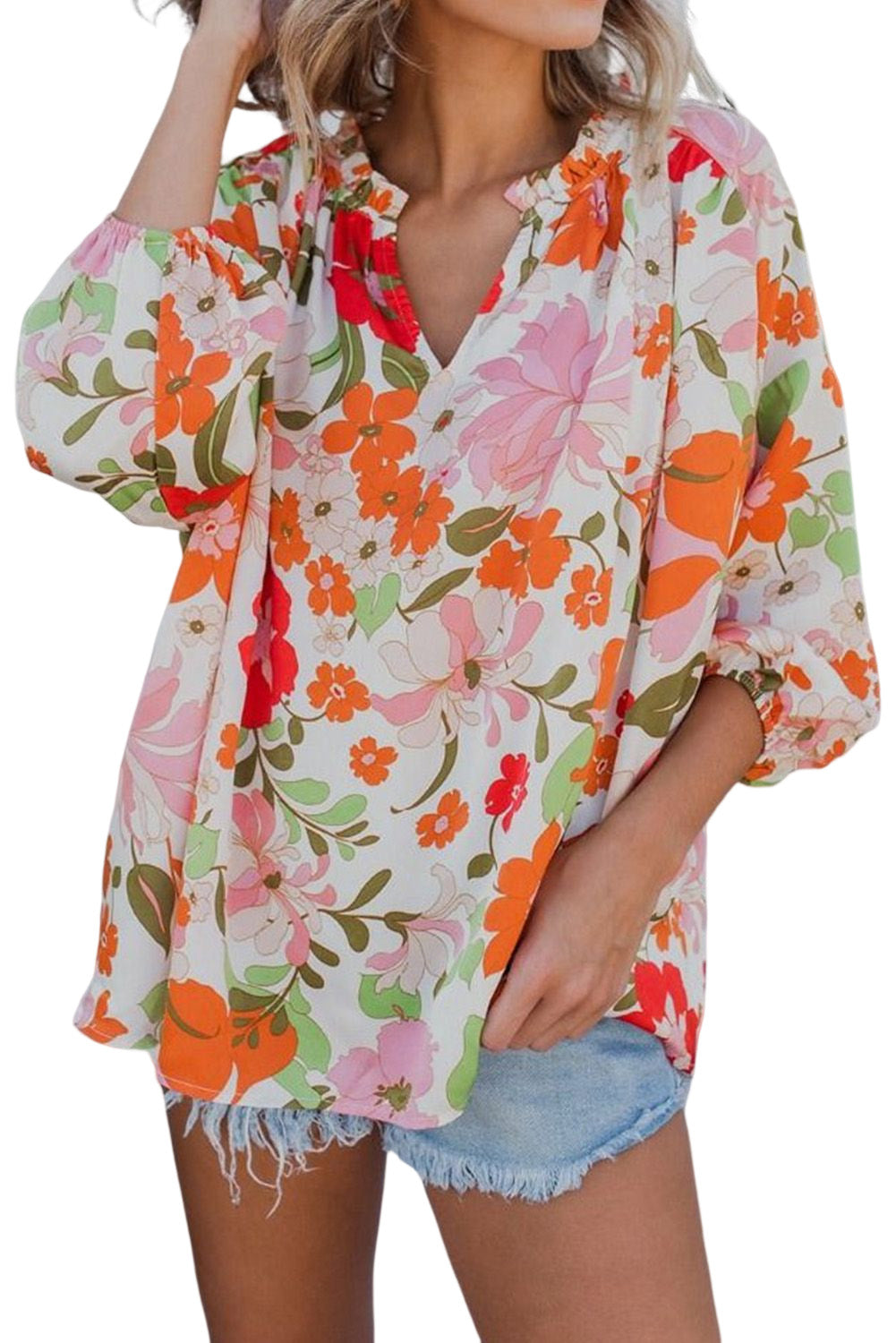 Blouse orange à manches bouffantes et à volants et fleurs épanouies