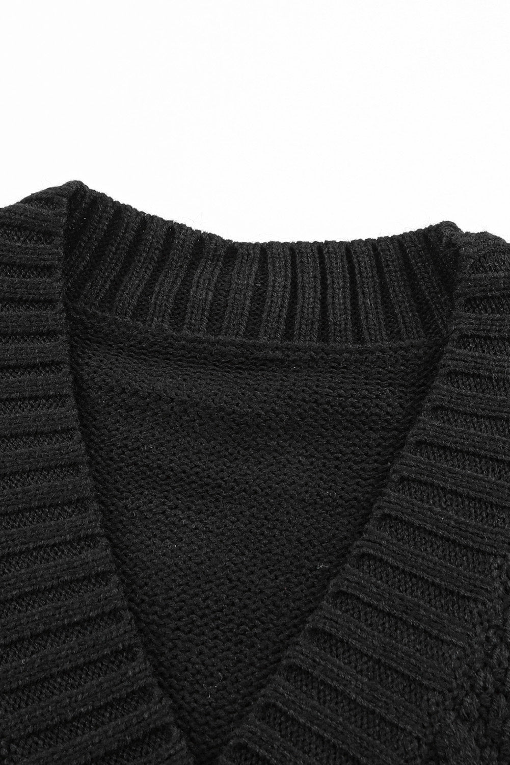 Cardigan texturé noir avec poches avant et boutons