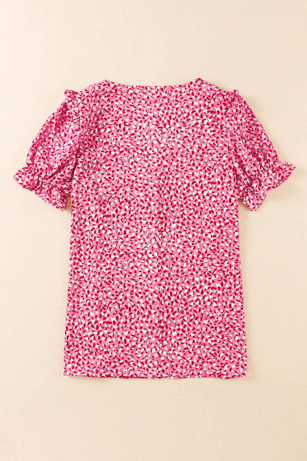 Chemise rose à manches volantées et boutonnée à imprimé abstrait