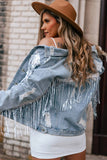 Veste en jean effet vieilli à franges ornées de sequins bleu ciel