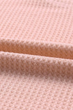 Haut en tricot gaufré rose à col large et droit