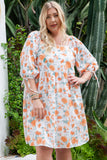 Robe florale orange à manches nouées et col carré de grande taille 