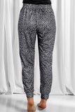 Pantalon de jogging gris à pois et cordon de serrage