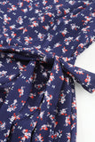 Robe bleue smockée à imprimé floral et manches bouffantes à col carré